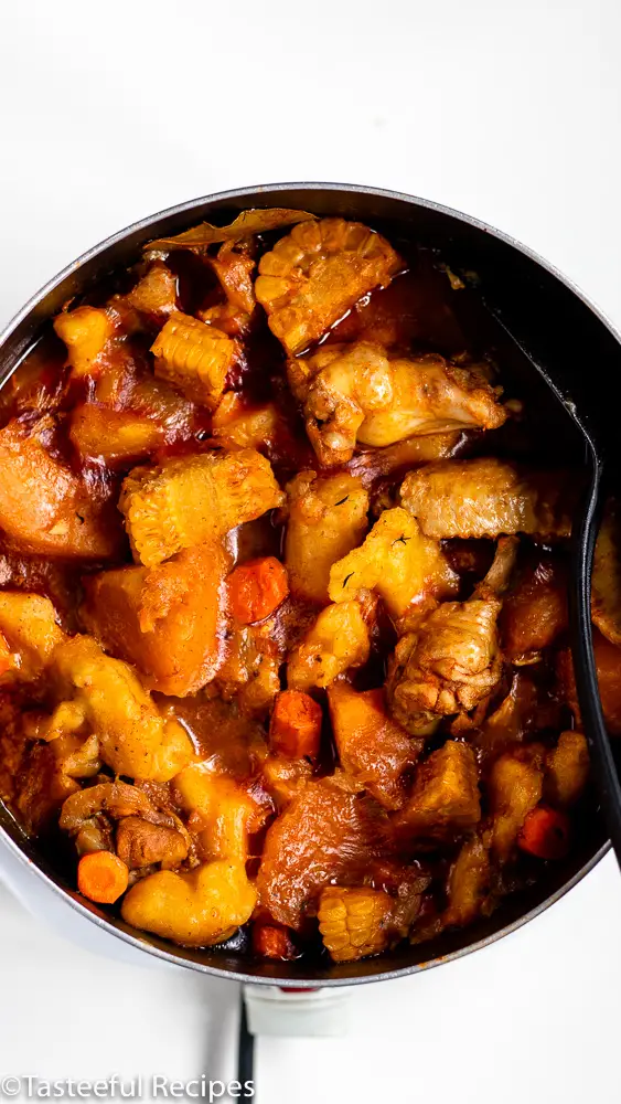 Overhead shot of a pot of caribbean chicken soup