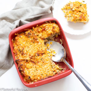 Overhead shot of Trinidad bacon corn pie with a serving spoon