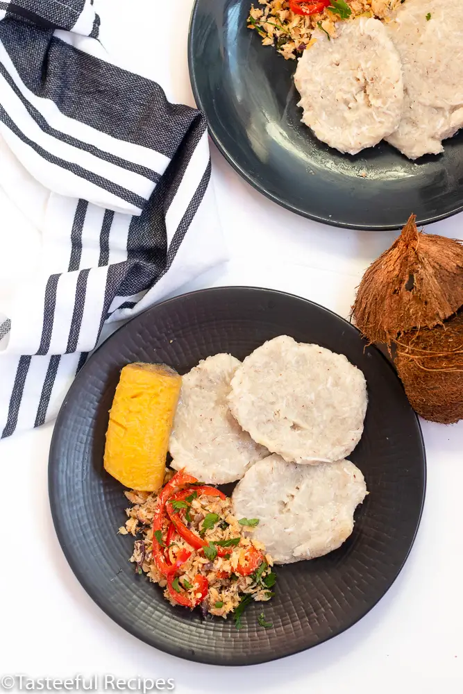 Overhead shot of boiled Caribbean coconut dumplings on a plate
