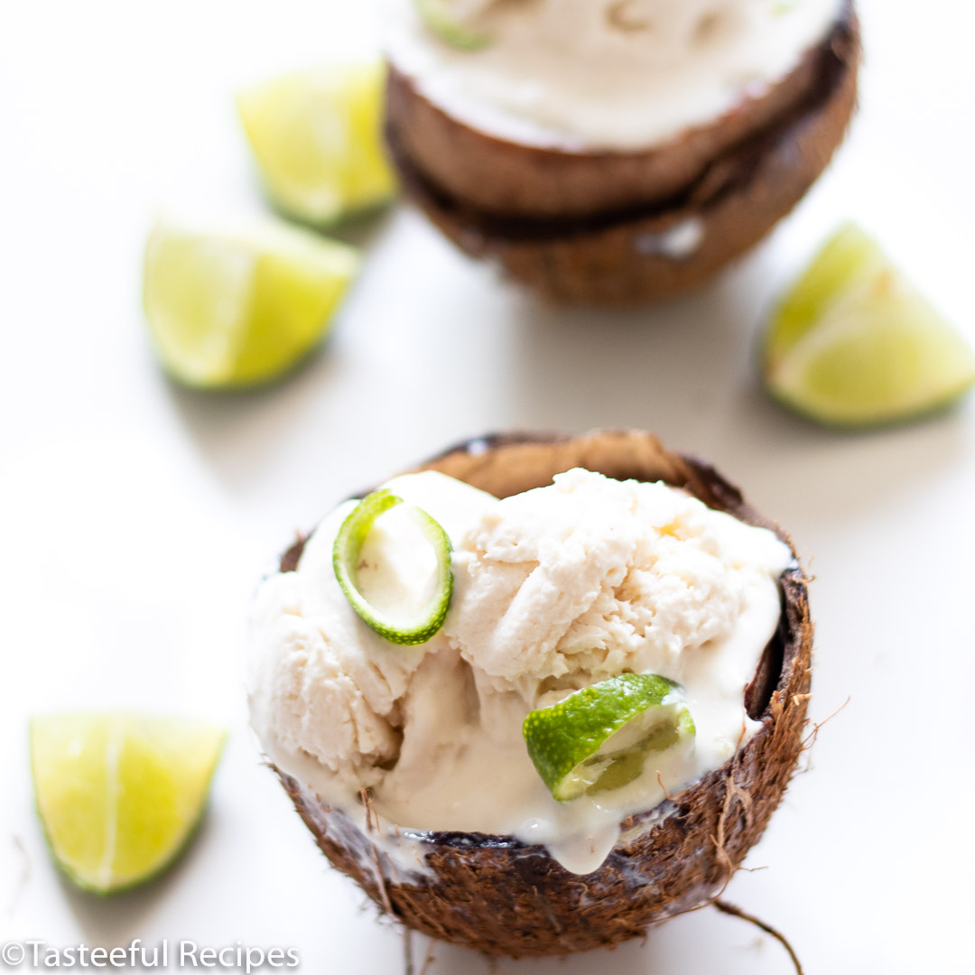 Angled shot of coconut lime ice cream in a fresh coconut