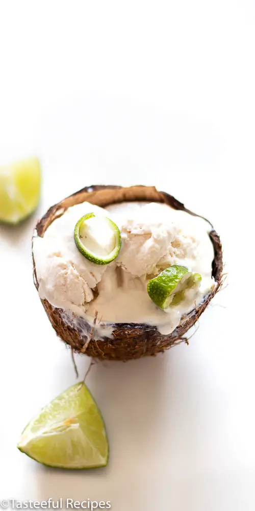 Angled shot of coconut lime ice cream in a fresh coconut