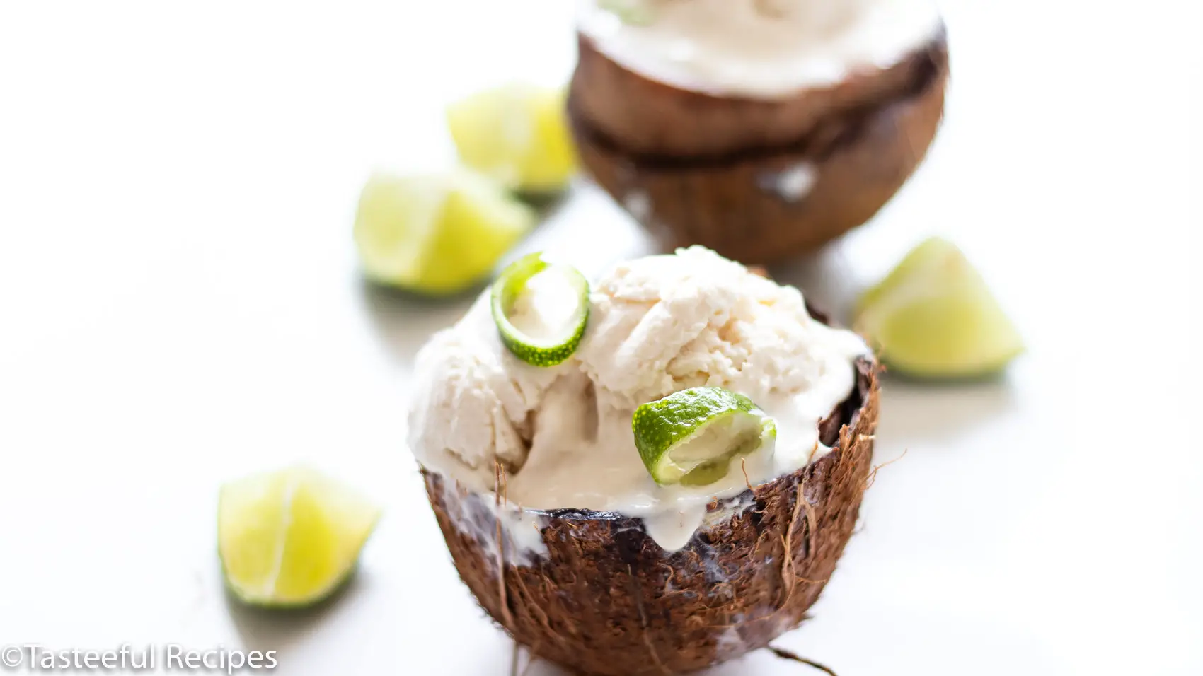 Straight on shot of coconut lime ice cream in a fresh coconut