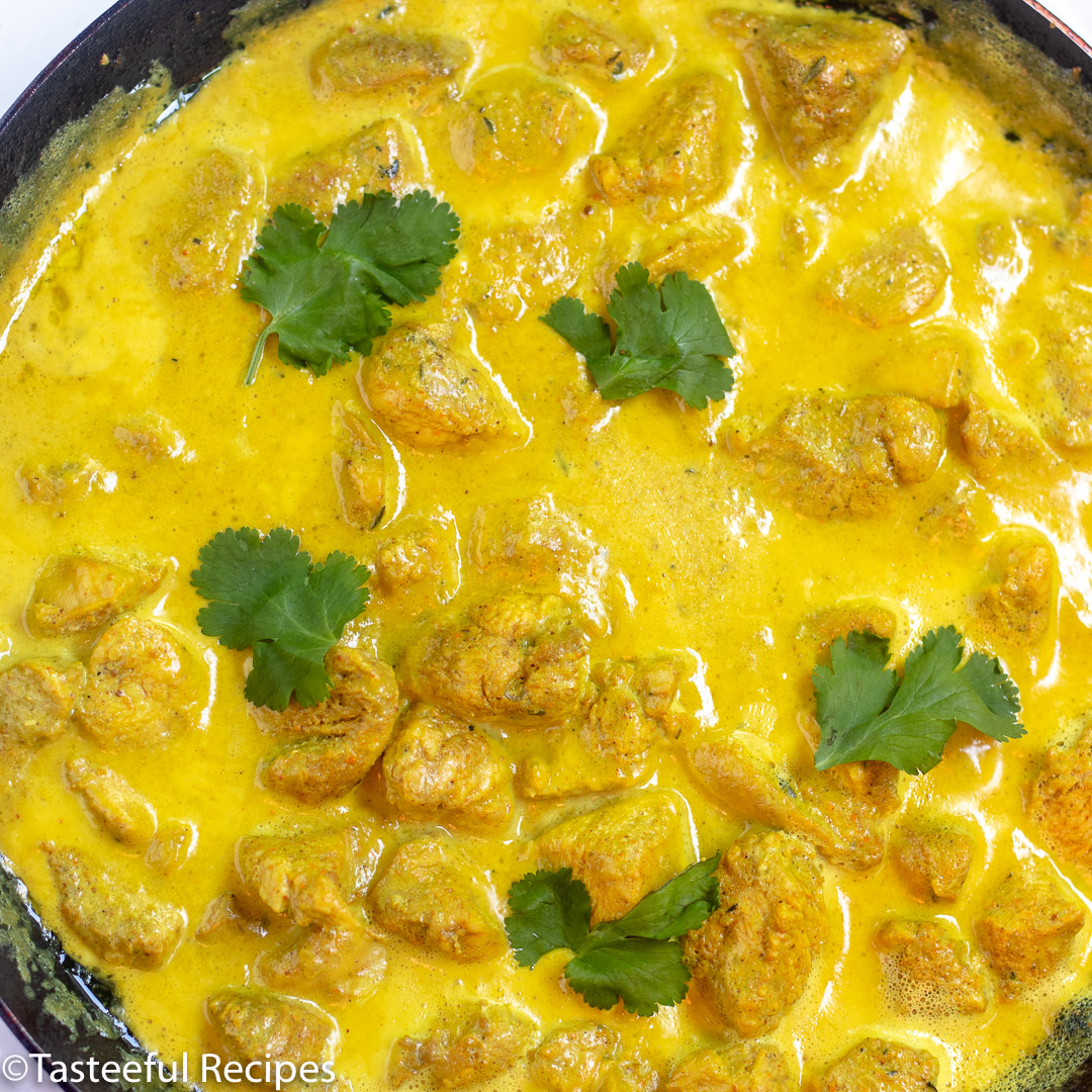 Overhead shot of a skillet of creamy curry chicken