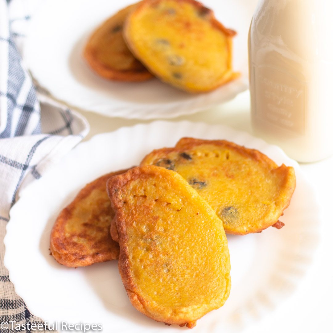 Angled shot of Caribbean pumpkin fritters on a plate