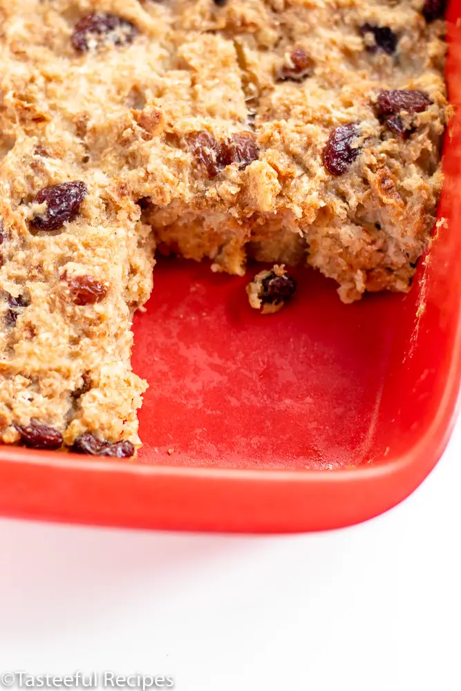 Angled shot of a baking dish of bread pudding pudding