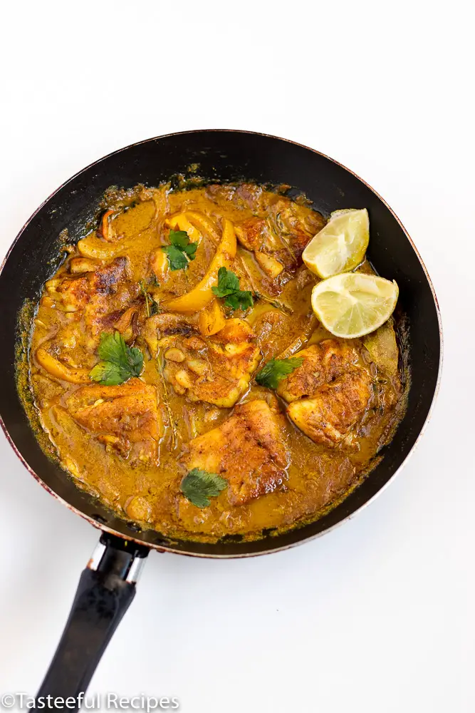 Overhead shot of a skillet with Caribbean coconut curry fish