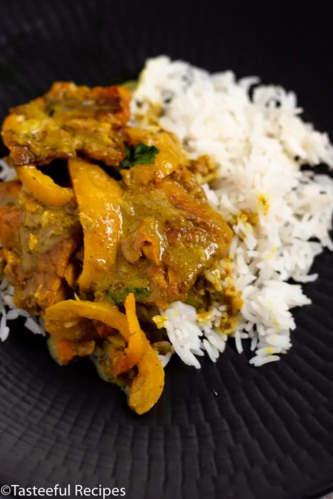 Straight on shot of a plate of coconut curry fish