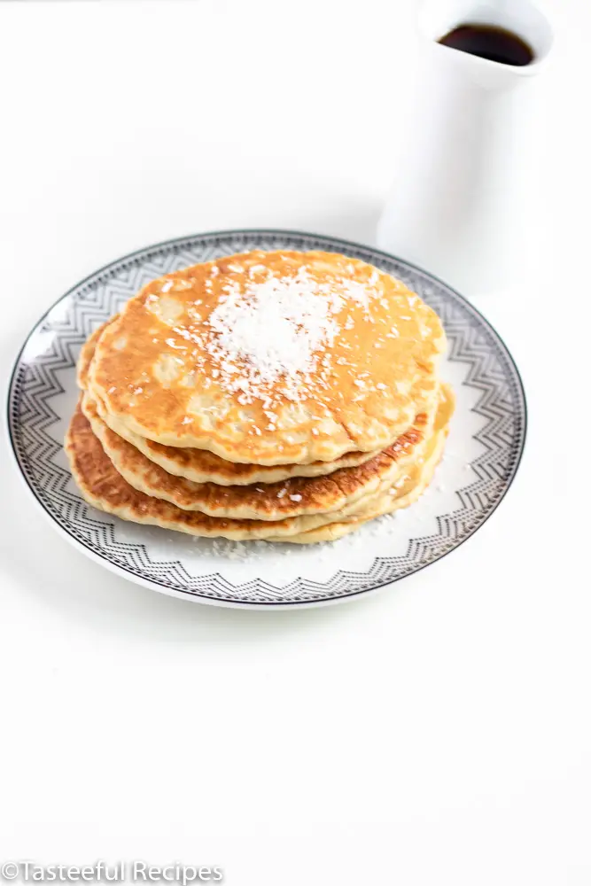 Angled shot of a stack of coconut milk pancakes