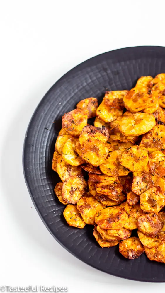 Overhead shot of a plate of jerk plantain chips 