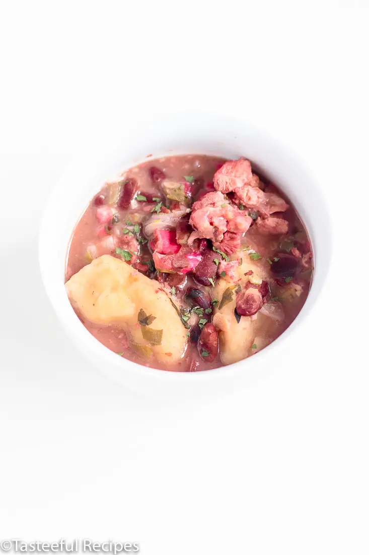 Overhead shot of a bowl of pigtails and red beans soup