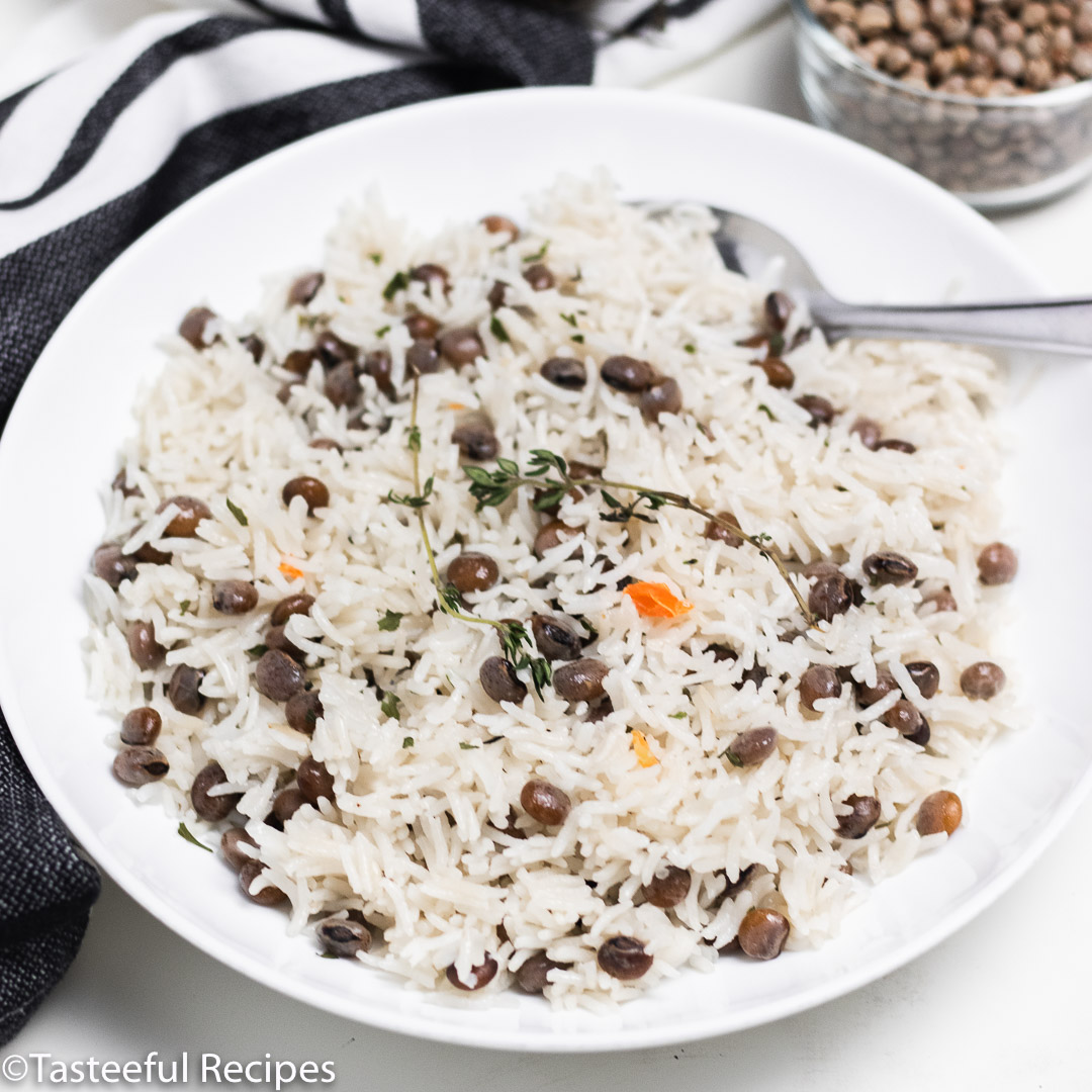 Angled shot of a plate of Jamaican style rice pigeon peas