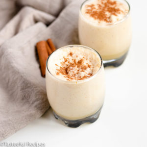 Angled shot of two glasses of non-alcoholic eggnog