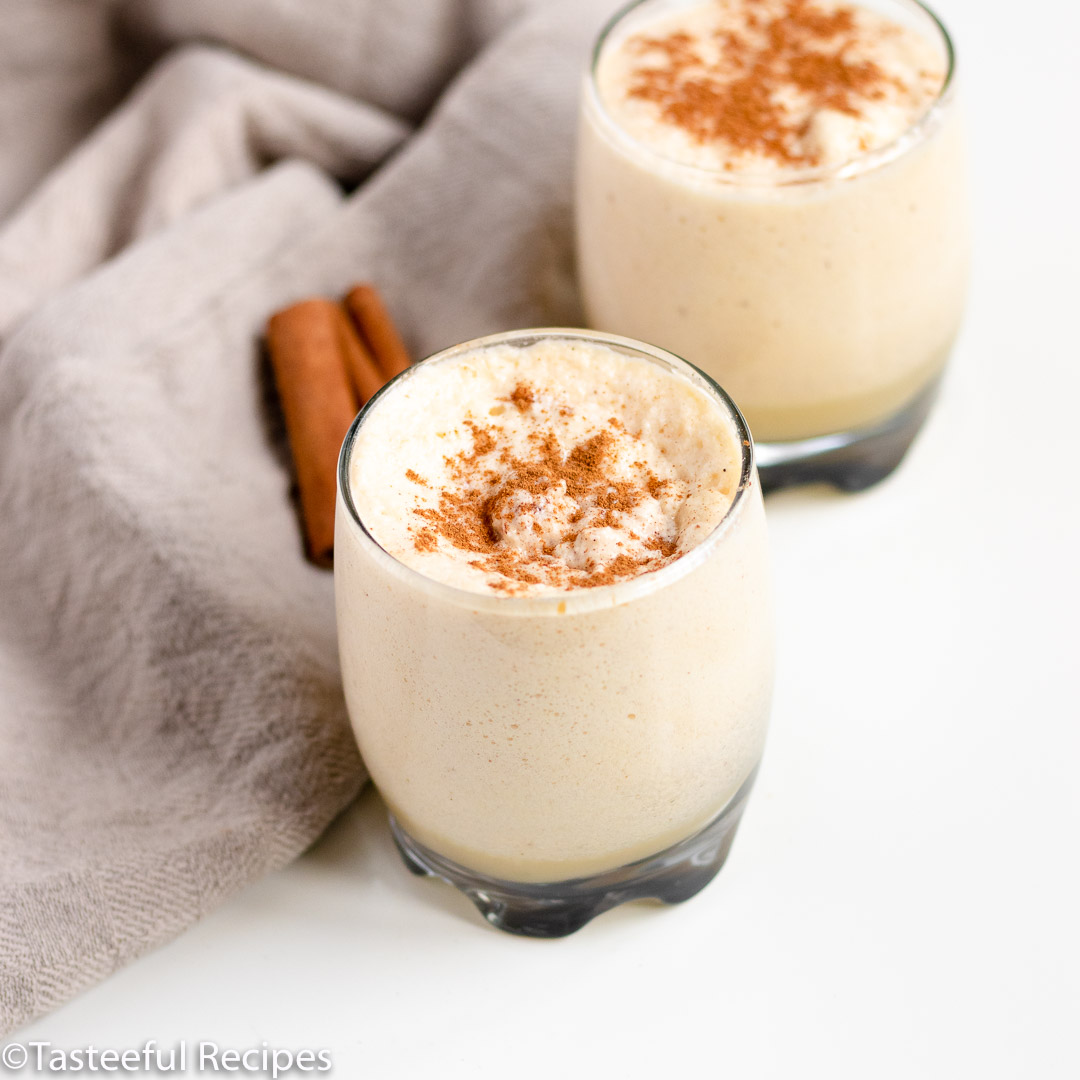 Angled shot of two glasses of non-alcoholic eggnog