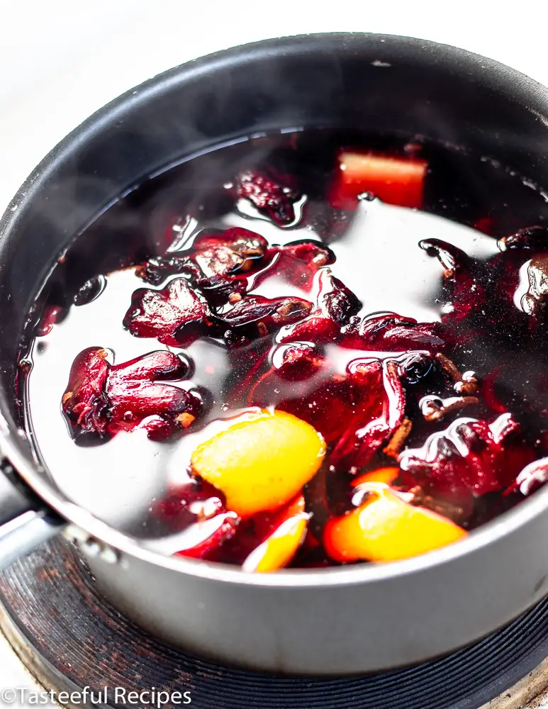 Angled shot of a pot of sorrel juice being boiled