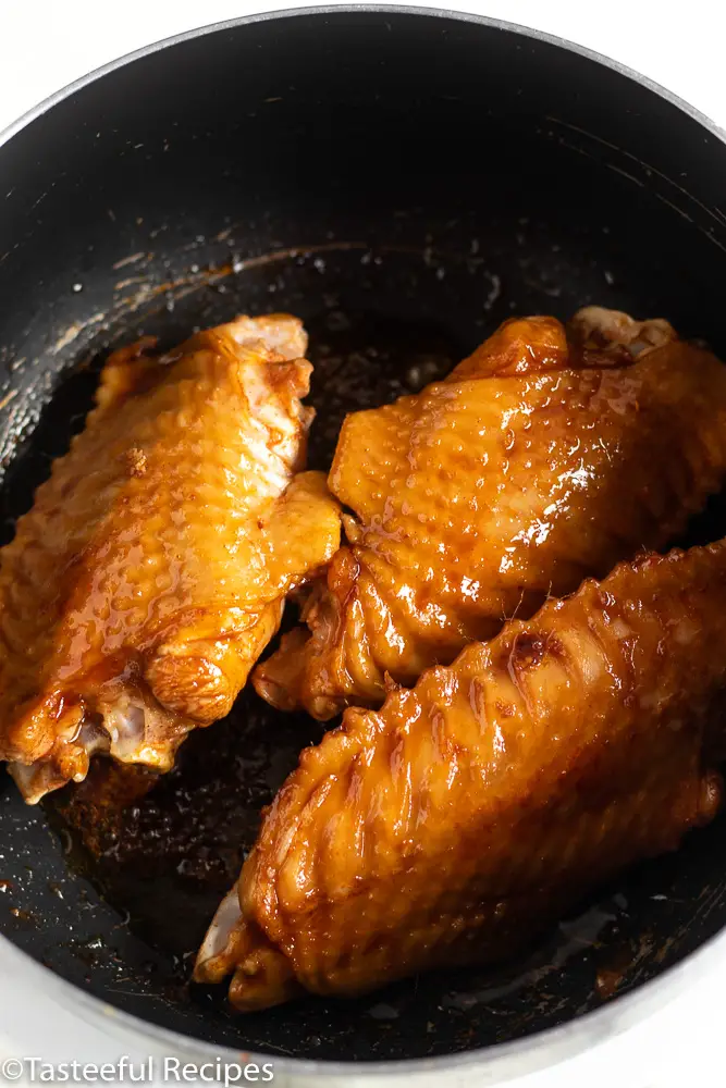 Overhead shot of turkey wings being cooked in a pot