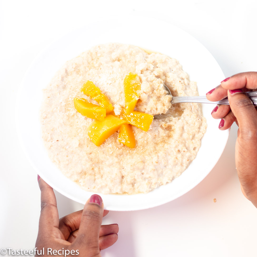 Overhead shot of coconut mango oatmeal being eaten