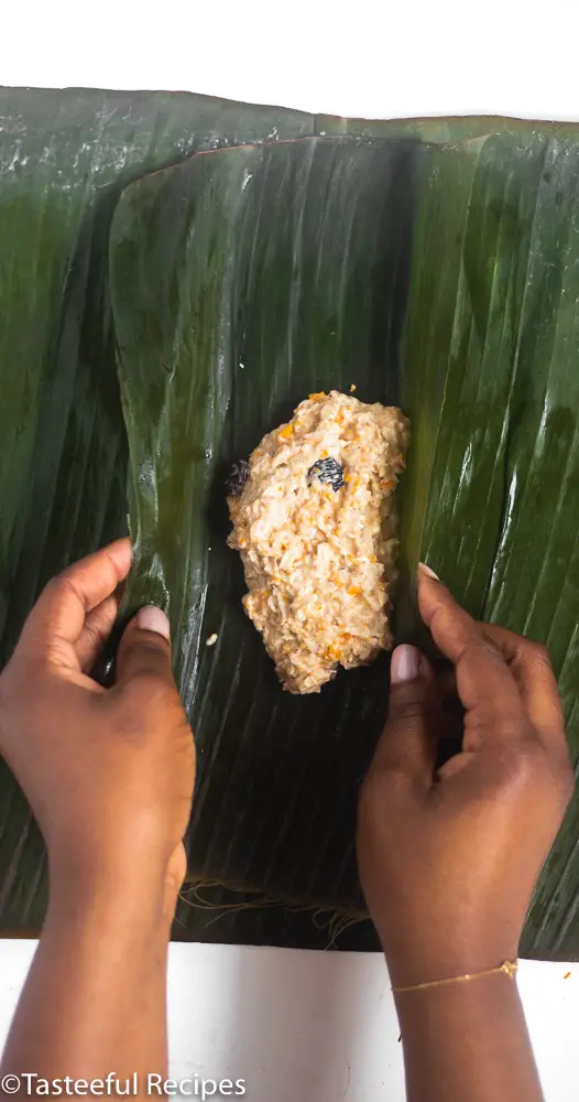 Caribbean conkies being wrapped in banana leaf