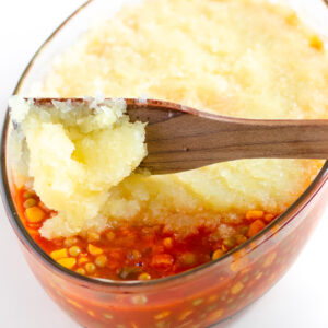 Angled shot of green papaya pie in a baking dish