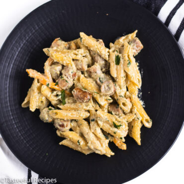 overhead shot of caribbean sausage pasta on a plate