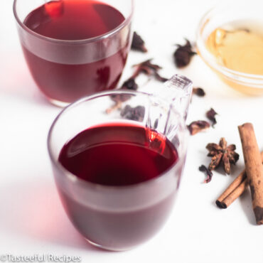 Angled shot of two cups of Caribbean sorrel tea