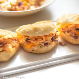 Angled shot of fry bake and saltfish on a platter