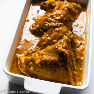 Close up shot of a pan of caribbean curry chicken