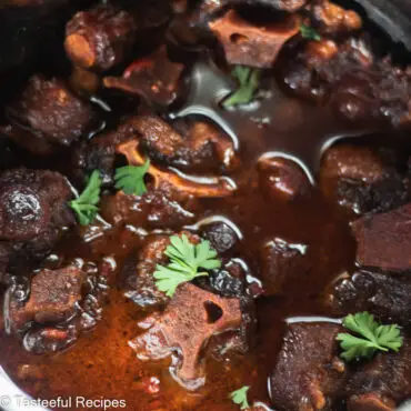 Close up shot of Caribbean stewed oxtails in a pot