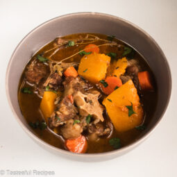 Overhead shot of a bowl of Caribbean style oxtail soup