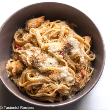 Overhead shot of a bowl of spicy coconut chicken pasta